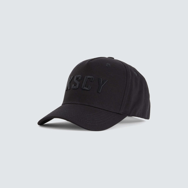 model wears Winsted 5 Panel Curved Peak Cap Black Headwear Black - image 4