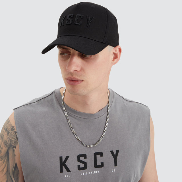model wears Winsted 5 Panel Curved Peak Cap Black Headwear Black - image 2