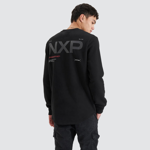 model wears Adjacent Dual Curved Sweater Jet Black Jumpers Black - image 1