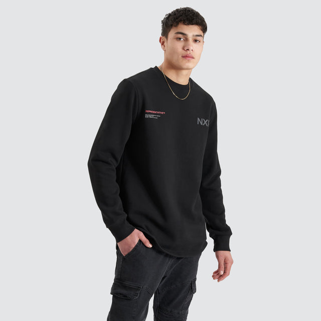 model wears Adjacent Dual Curved Sweater Jet Black Jumpers Black - image 2