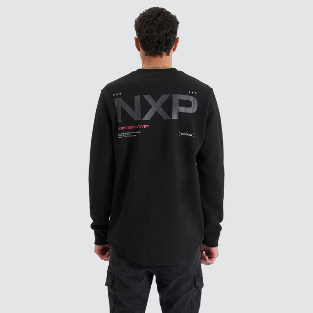 model wears Adjacent Dual Curved Sweater Jet Black Jumpers Black - image 5