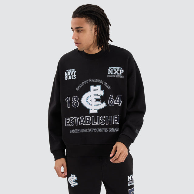 model wears Carlton Blues AFL Box Fit Sweater Jet Black Jumpers Black - image 1