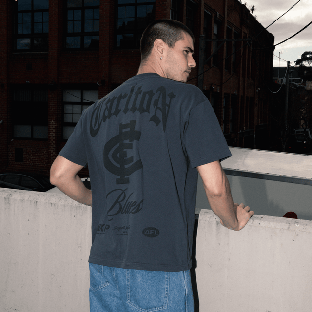model wears Carlton Blues AFL Heavy Raptor Tee Asphalt T-Shirts Grey - image 2