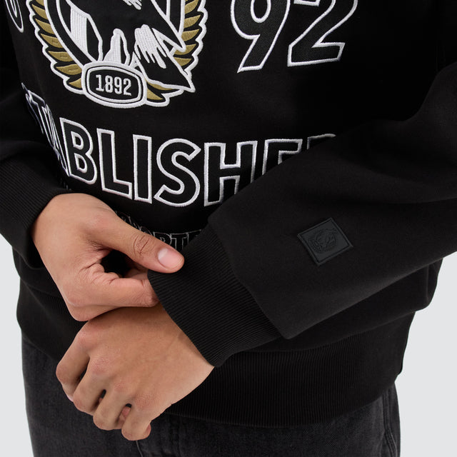 model wears Collingwood Magpies AFL Box Fit Sweater Jet Black Jumpers Black - image 3