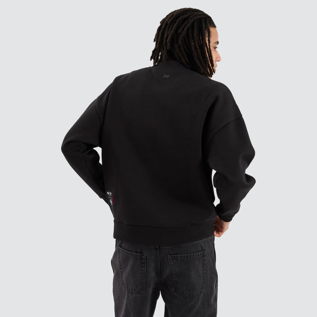 model wears Collingwood Magpies AFL Box Fit Sweater Jet Black Jumpers Black - image 6