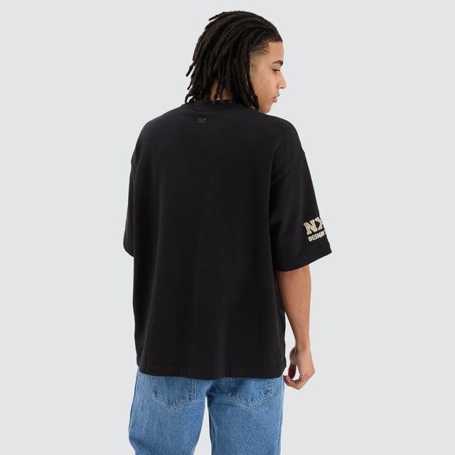 model wears Collingwood Magpies AFL Mega Loopback Tee Jet Black T-Shirts Black - image 5