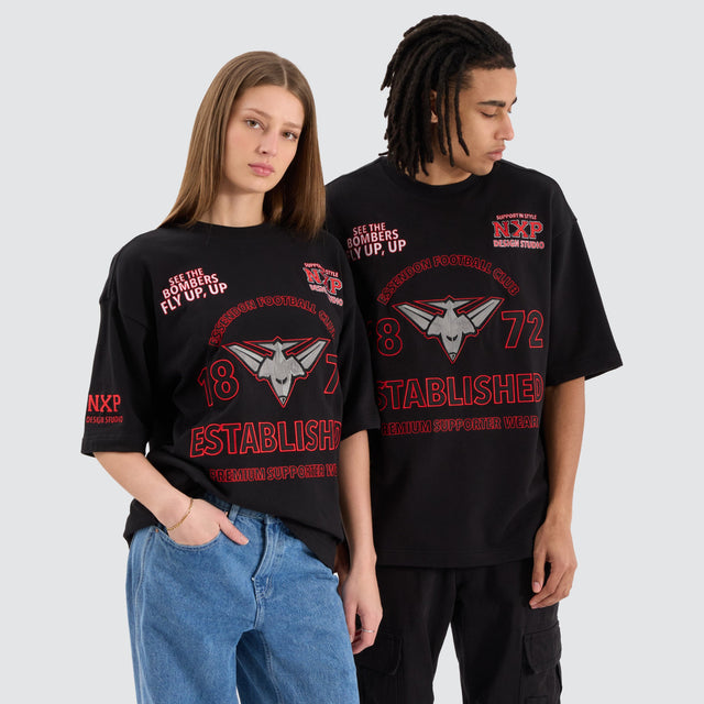 model wears Essendon Bombers AFL Mega Loopback Tee Jet Black T-Shirts Black - image 1