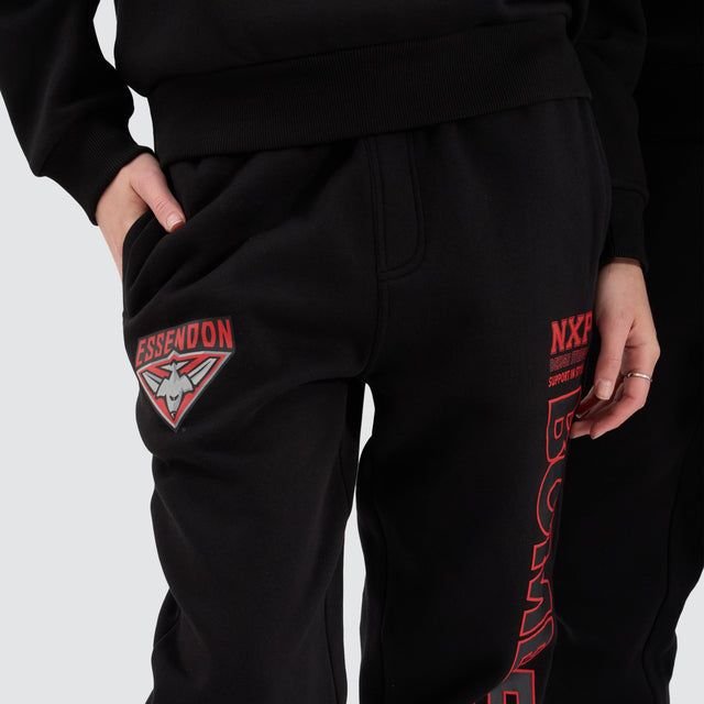 model wears Essendon Bombers AFL Trackpant Jet Black Trackpants Black - image 2