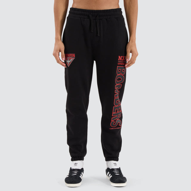 model wears Essendon Bombers AFL Trackpant Jet Black Trackpants Black - image 1