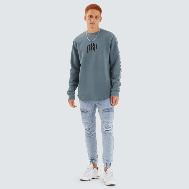 model wears Axis Dual Curved Sweater Pigment Stormy Weather Jumpers Teal - image 4