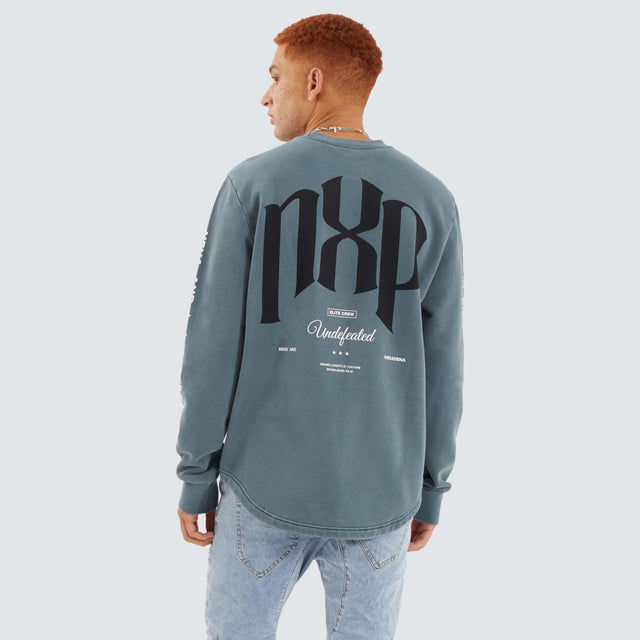 model wears Axis Dual Curved Sweater Pigment Stormy Weather Jumpers Teal - image 1