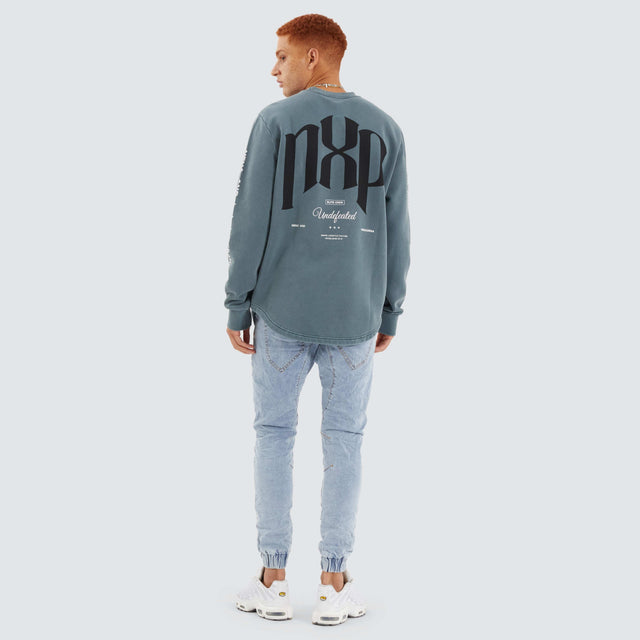 model wears Axis Dual Curved Sweater Pigment Stormy Weather Jumpers Teal - image 5