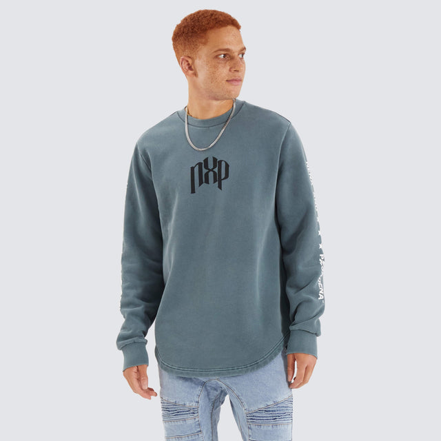 model wears Axis Dual Curved Sweater Pigment Stormy Weather Jumpers Teal - image 2