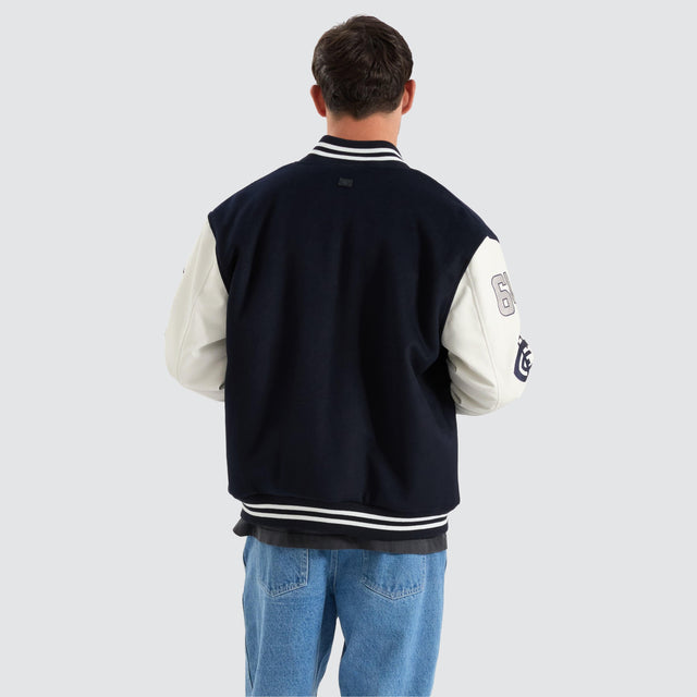 model wears Carlton Blues AFL Varsity Jacket Navy Jackets Blue - image 4