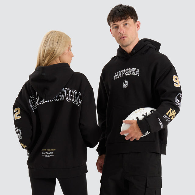 model wears Collingwood Magpies AFL Box Fit Hoodie Jet Black Hoodies Black - image 1