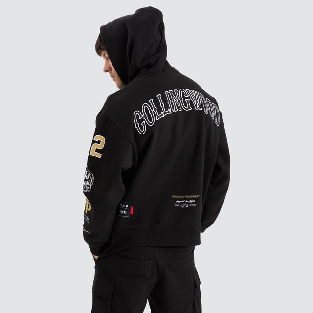 model wears Collingwood Magpies AFL Box Fit Hoodie Jet Black Hoodies Black - image 2
