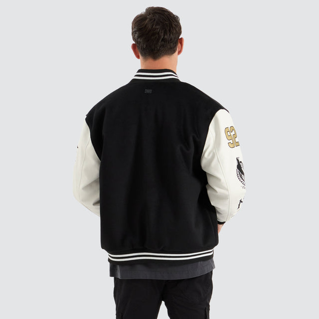 model wears Collingwood Magpies AFL Varsity Jacket Jet Black Jackets Black - image 4