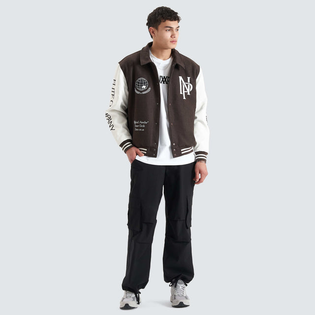model wears Facade Varsity Jacket After Dark Jackets Brown - image 6