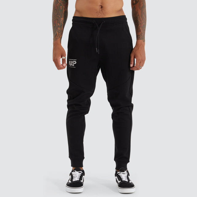 model wears Gambit Slim Trackpant Jet Black Trackpants Black - image 6