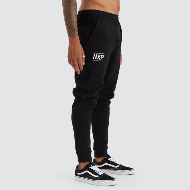 model wears Gambit Slim Trackpant Jet Black Trackpants Black - image 7