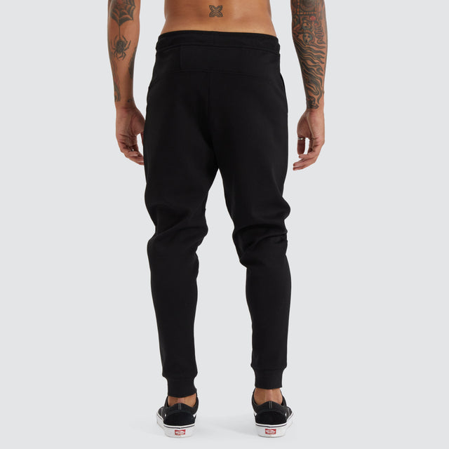 model wears Gambit Slim Trackpant Jet Black Trackpants Black - image 8
