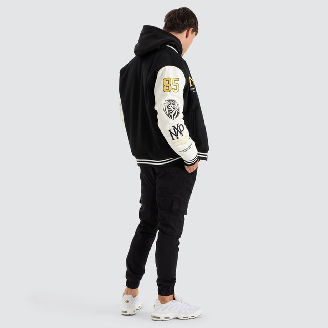 model wears Richmond Tigers AFL Varsity Jacket Jet Black Jackets Black - image 5
