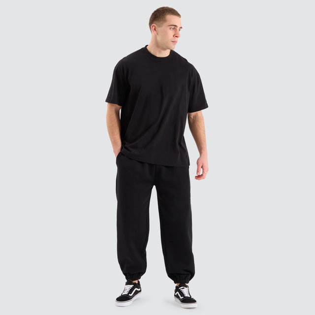 model wears Supply Baggy Sweat Pant Jet Black Trackpants Black - image 2