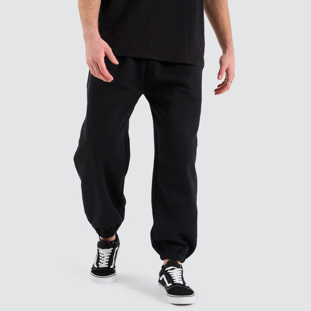 model wears Supply Baggy Sweat Pant Jet Black Trackpants Black - image 1