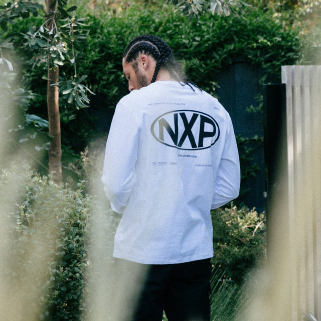 model wears Tensile Heavy Relaxed Longsleeve Tee Optical White Longsleeve T-Shirts White - image 2
