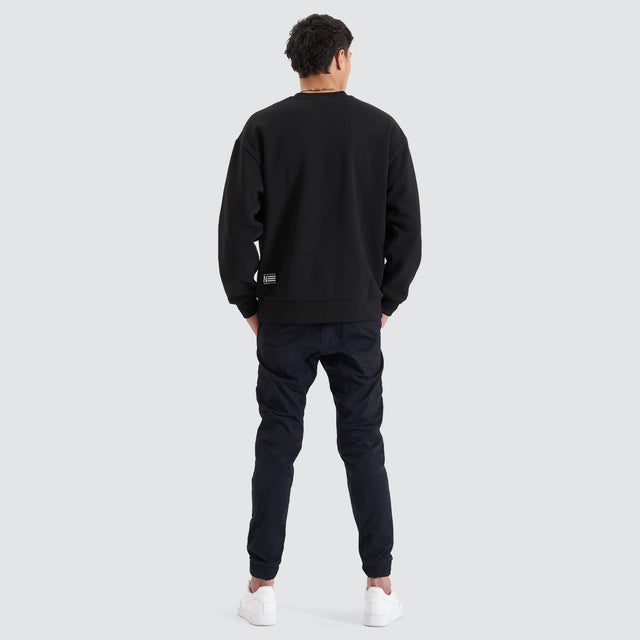 model wears Tracery Heavy Relaxed Jumper Jet Black Jumpers Black - image 3