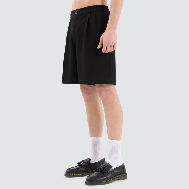 model wears Venture Pleated Dress Short Black Shorts Black - image 5