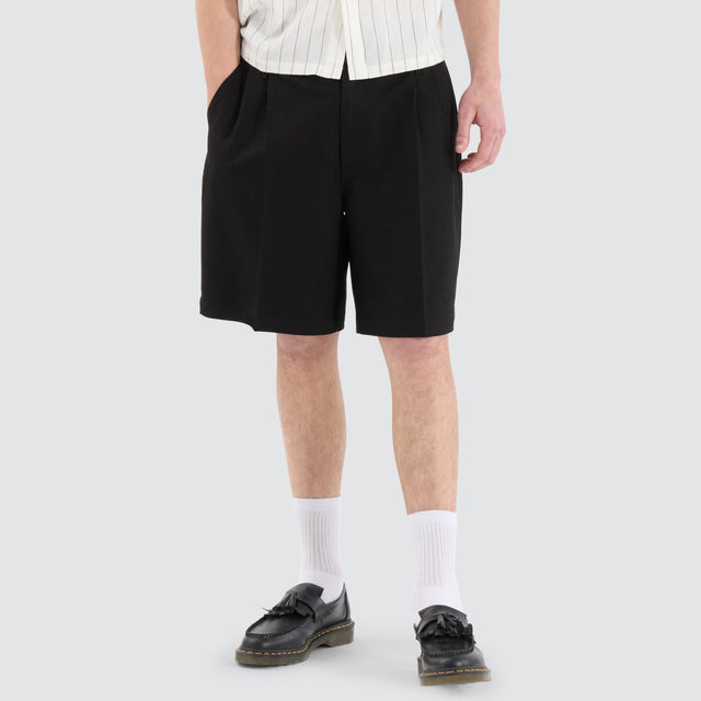 model wears Venture Pleated Dress Short Black Shorts Black - image 1
