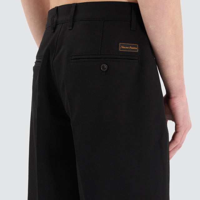 model wears Venture Pleated Dress Short Black Shorts Black - image 4