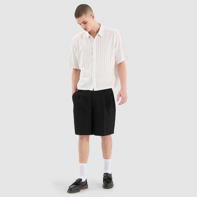 model wears Venture Pleated Dress Short Black Shorts Black - image 2