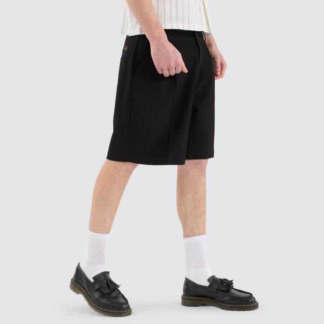 model wears Venture Pleated Dress Short Black Shorts Black - image 3