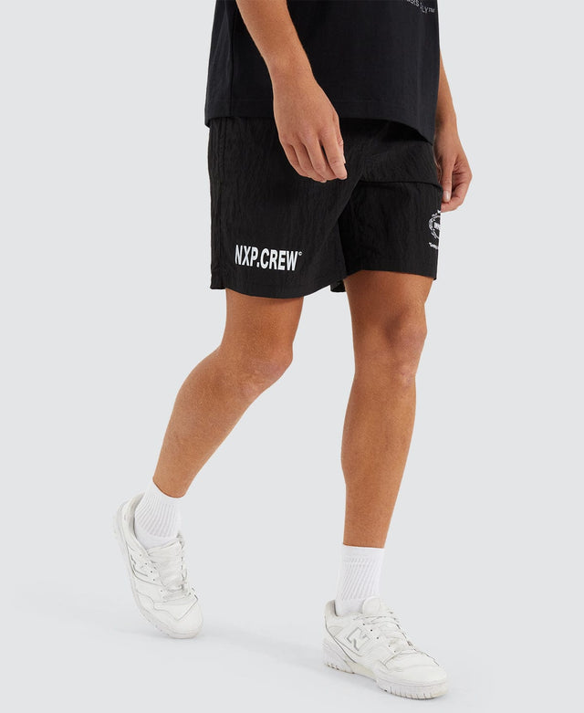 model wears Action Shorts Black Shorts Black - image 8