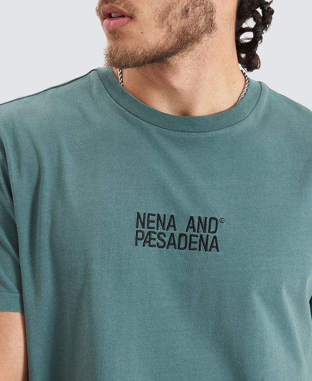 model wears Blockade Dual Curved Tee Pigment Silver Pine T-Shirts Teal - image 2