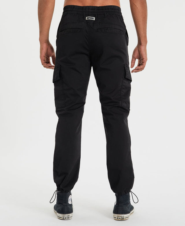 model wears Brigade Cargo Pants Black Pants Black - image 3