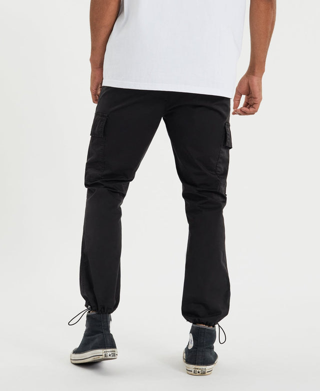 model wears Brigade Cargo Pants Black Pants Black - image 6