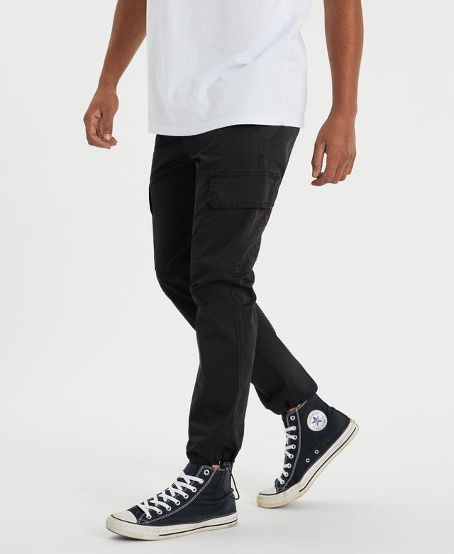 model wears Brigade Cargo Pants Black Pants Black - image 5