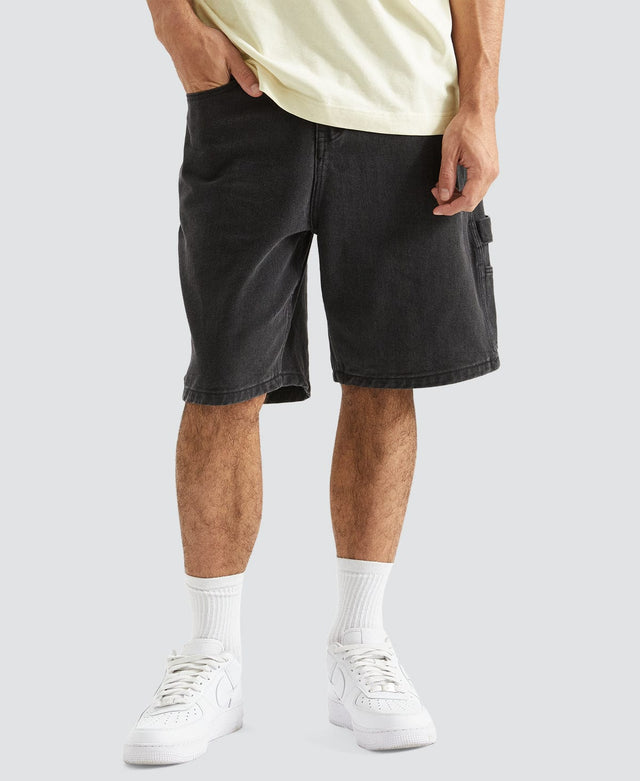 model wears Built Carpenter Jort Shorts Black Shorts Black - image 1
