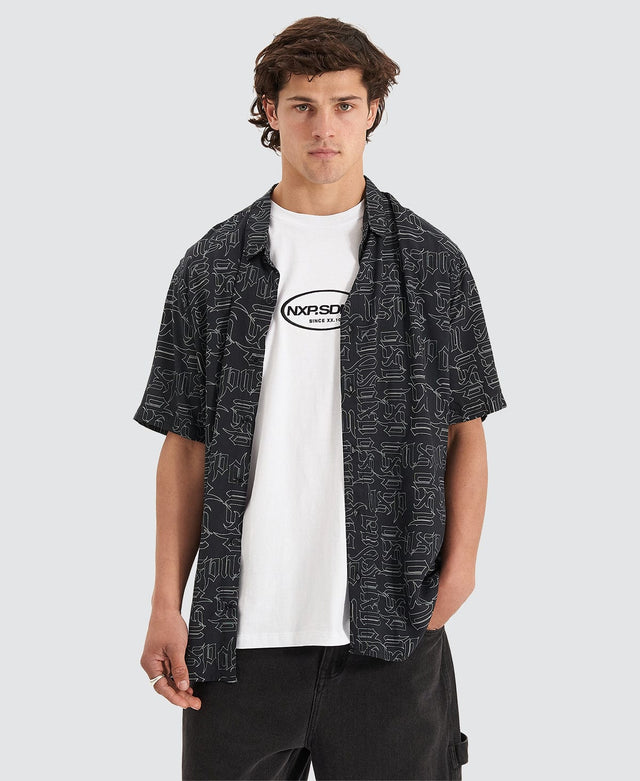 model wears Criminalisation Relaxed Short Sleeve Shirt Black Print Short Sleeve Shirts Black - image 1