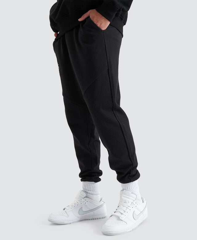 model wears Gambit Slim Trackpant Jet Black Trackpants Black - image 4