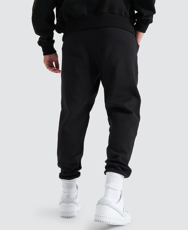 model wears Gambit Slim Trackpant Jet Black Trackpants Black - image 5