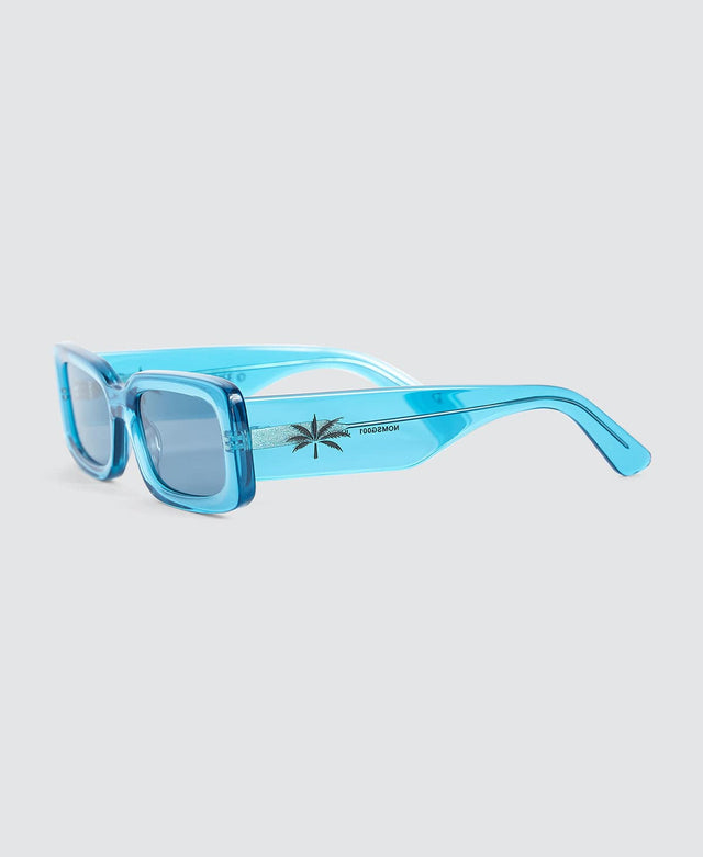 model wears Jungle Boy Sunglasses Transparent Blue Sunglasses Blue - image 2
