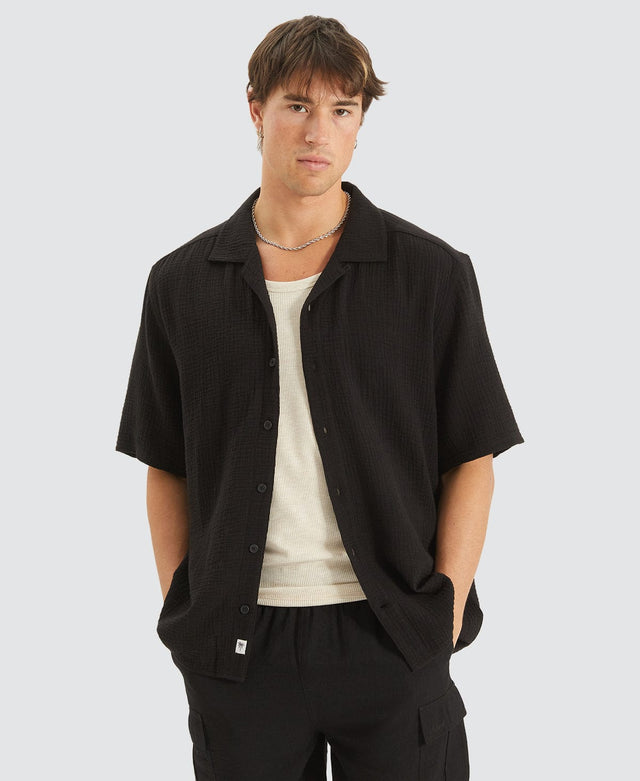 model wears Psych Cropped Resort Shirt Black Short Sleeve Shirts Black - image 1