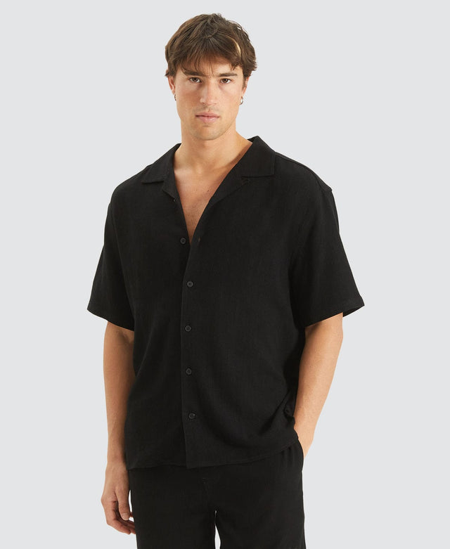model wears Stoked Cropped Resort Shirt Black Short Sleeve Shirts Black - image 1
