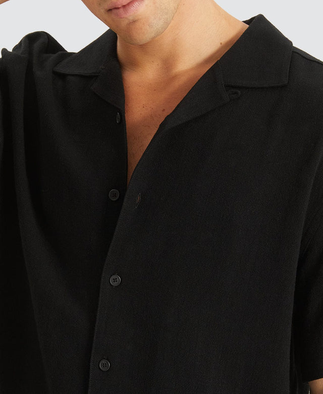 model wears Stoked Cropped Resort Shirt Black Short Sleeve Shirts Black - image 2