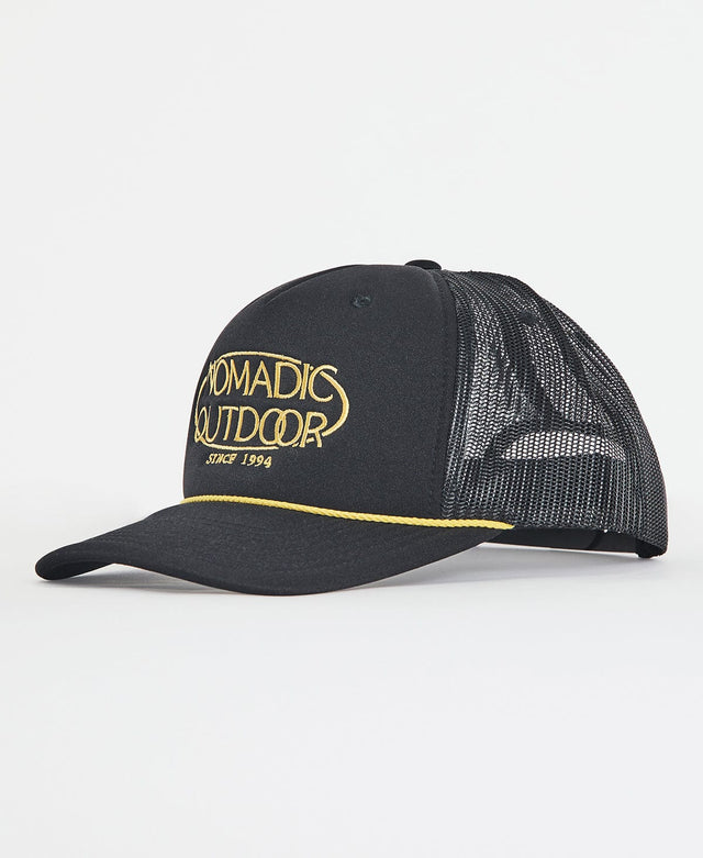model wears Strand Trucker Cap Jet Black Headwear Black - image 2