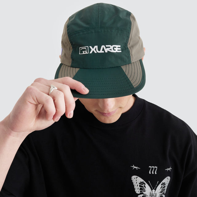 model wears Two Thousand Camp Cap Grey/Forest Headwear Grey - image 1